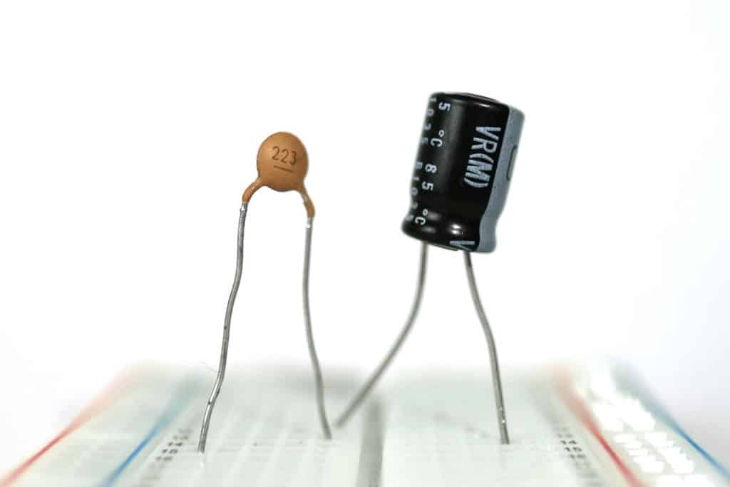 Two capacitors on a breadboard