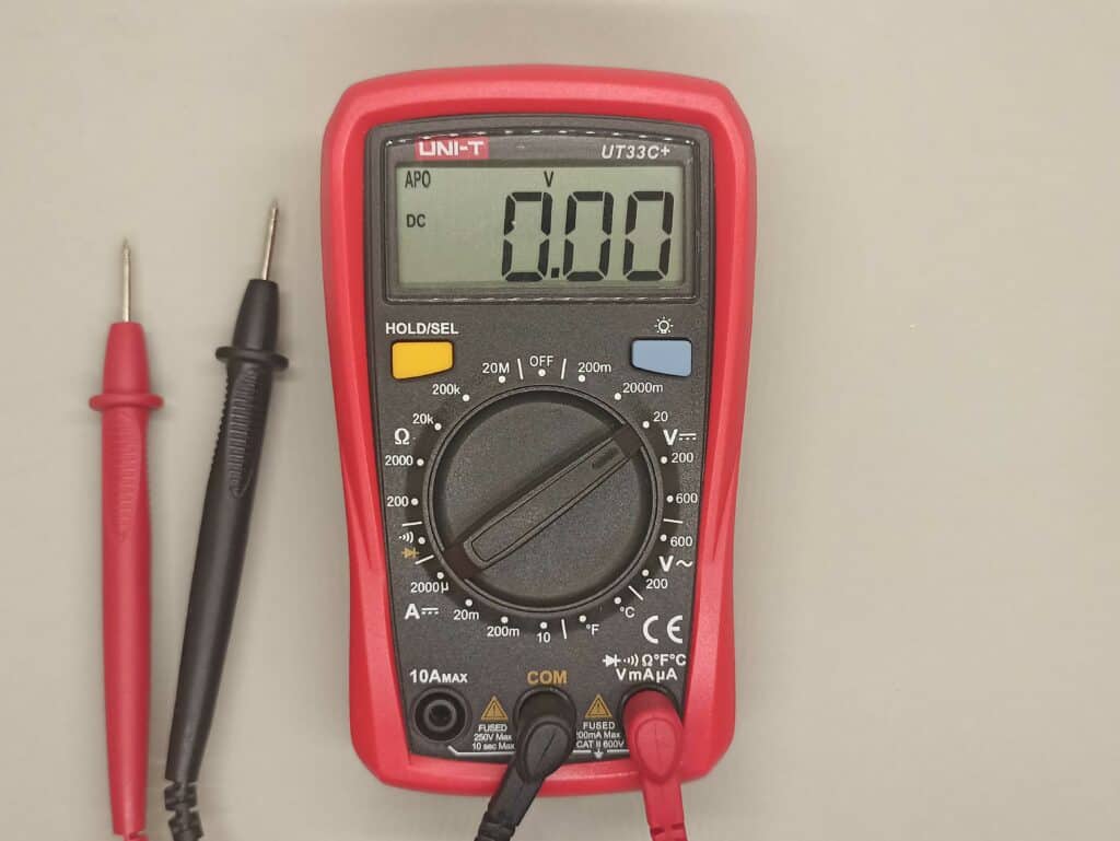 A multimeter with probes, turned on