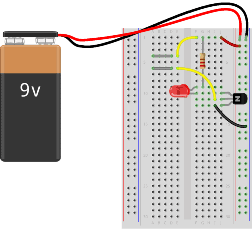 Breadboard with the complete touch sensor circuit connected to battery